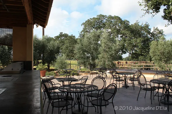 An outdoor dining area with tables and chairs.