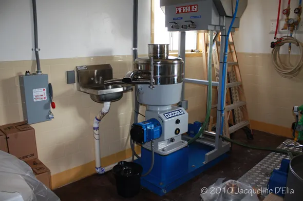 A blue and white machine sitting in a room.