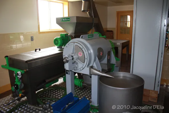 A machine that is used to make flour in a factory.