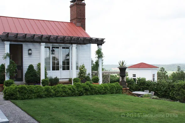 A white house with a red roof.