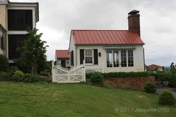 A white house with a red roof.