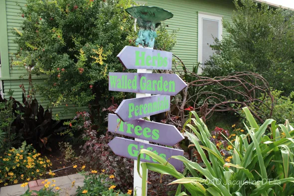 A house with a sign in front of it.
