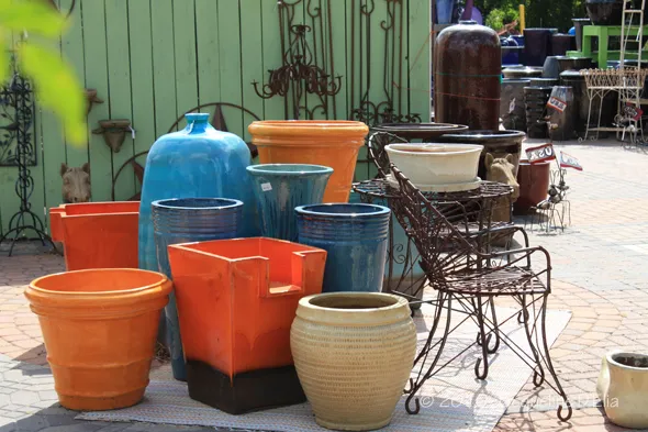 A group of pots and a chair.