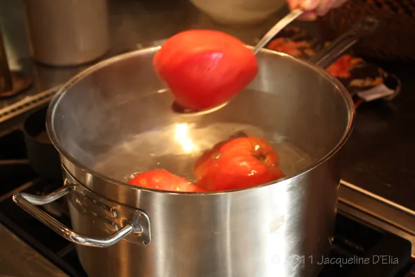 Removing tomatoes from boiling water