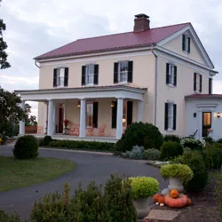 A white house with a red roof.